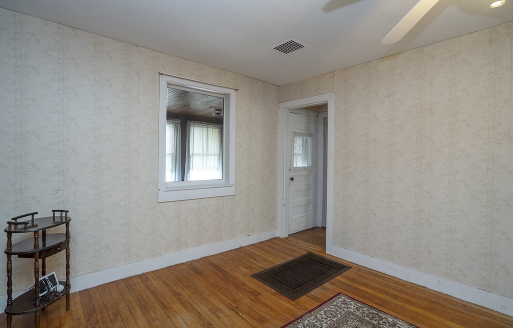 15 Beacon Street Amesbury, MA 01913 - Photo 12 of 41 a view of a room with wooden floor and bedroom