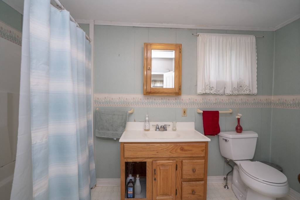 15 Beacon Street Amesbury, MA 01913 - Photo 13 of 41 a bathroom with a sink toilet and window