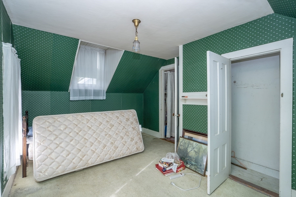 15 Beacon Street Amesbury, MA 01913 - Photo 15 of 41 a living room with a couch and a table