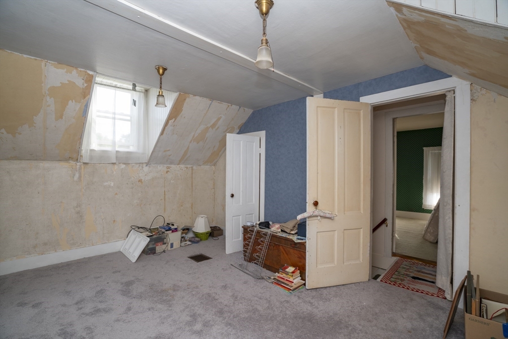 15 Beacon Street Amesbury, MA 01913 - Photo 17 of 41 a room with gym equipment and a mirror