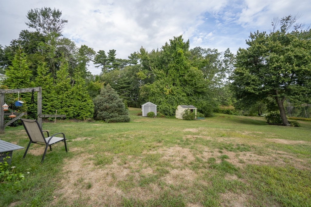 15 Beacon Street Amesbury, MA 01913 - Photo 22 of 41 a backyard of a house with table and chairs