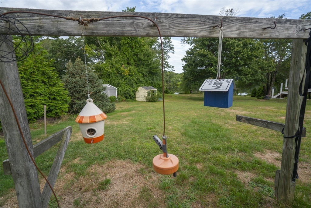 15 Beacon Street Amesbury, MA 01913 - Photo 23 of 41 a view of a backyard with a swing and plants