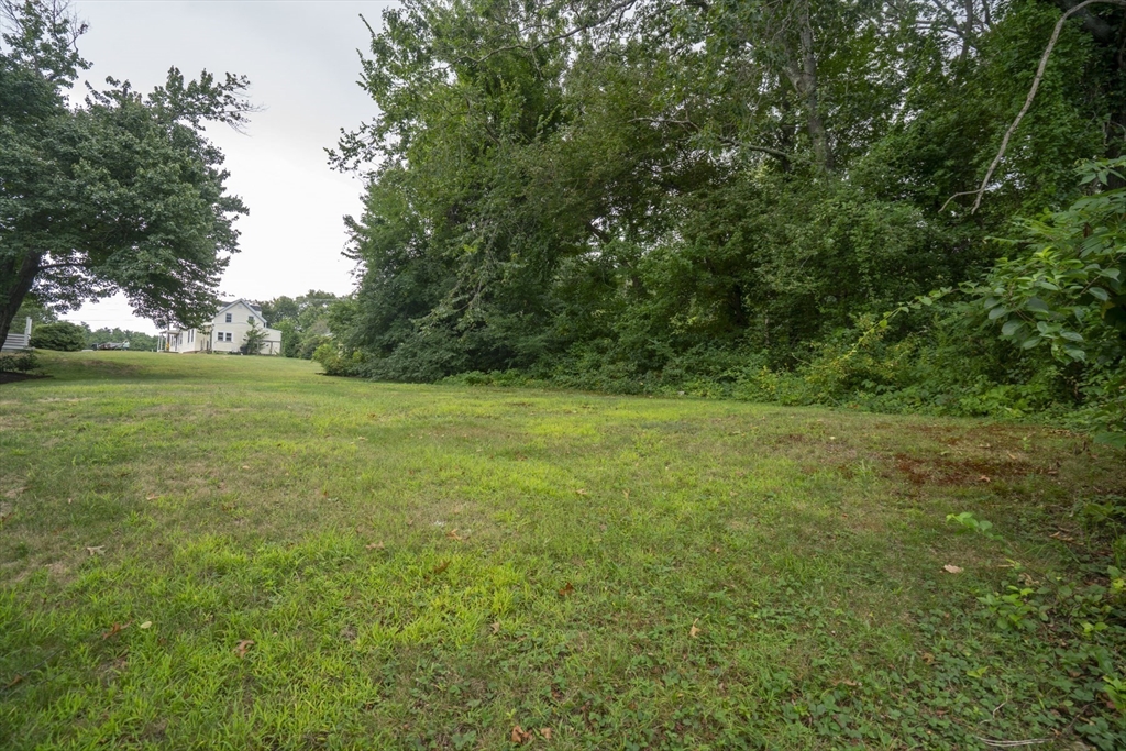 15 Beacon Street Amesbury, MA 01913 - Photo 26 of 41 a view of a field with a trees in the background