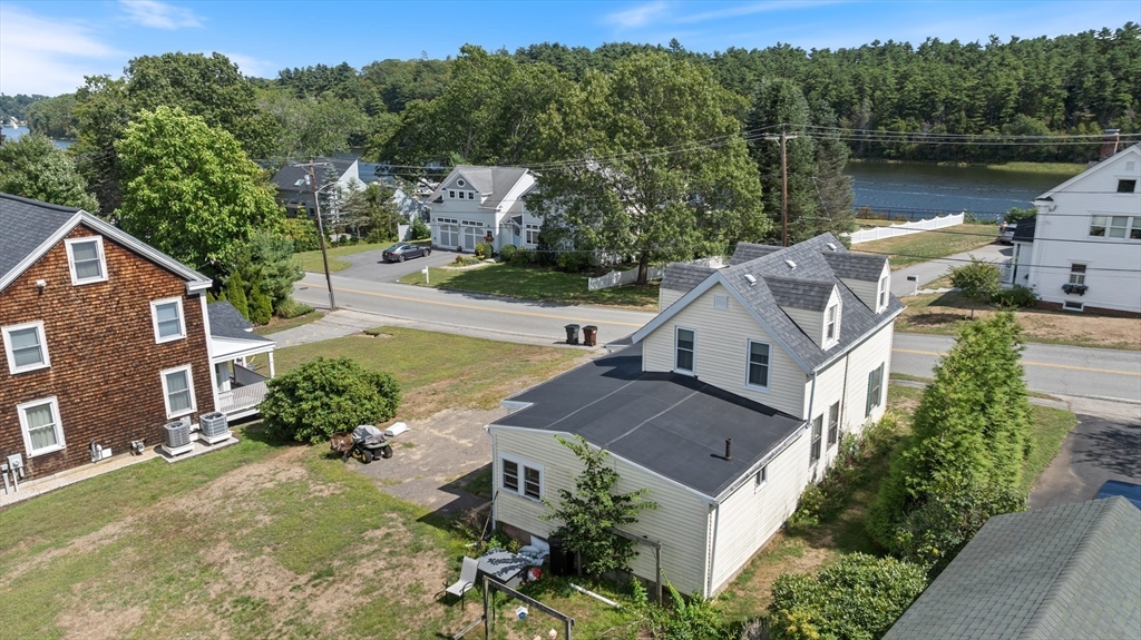 15 Beacon Street Amesbury, MA 01913 - Photo 29 of 41 an aerial view of a house with a garden and lake view