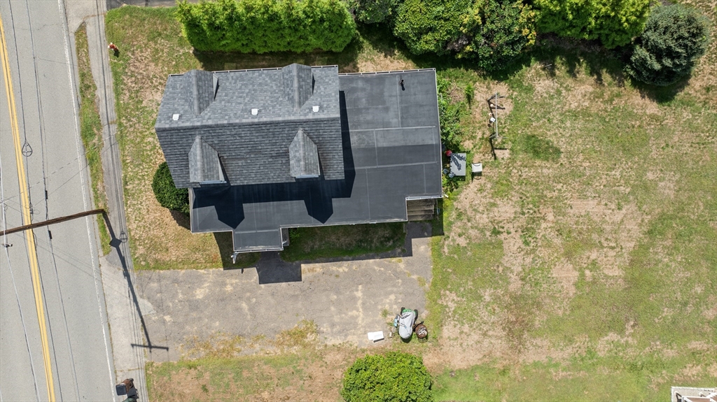 15 Beacon Street Amesbury, MA 01913 - Photo 34 of 41 a aerial view of a house with a yard and large tree