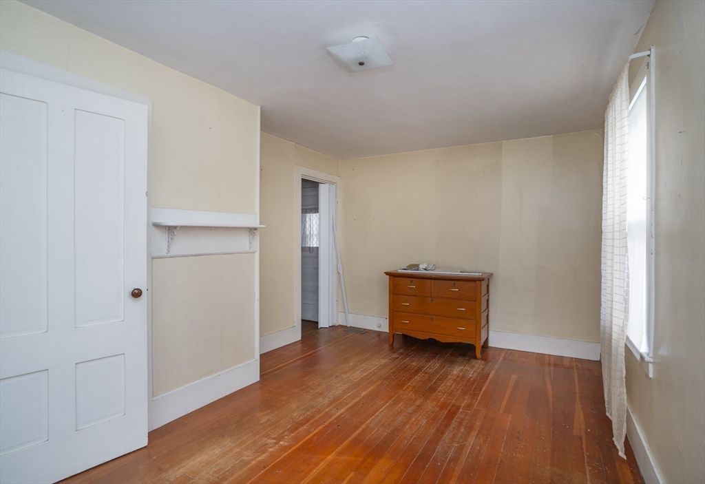 15 Beacon Street Amesbury, MA 01913 - Photo 10 of 41 a room with wooden floor and window