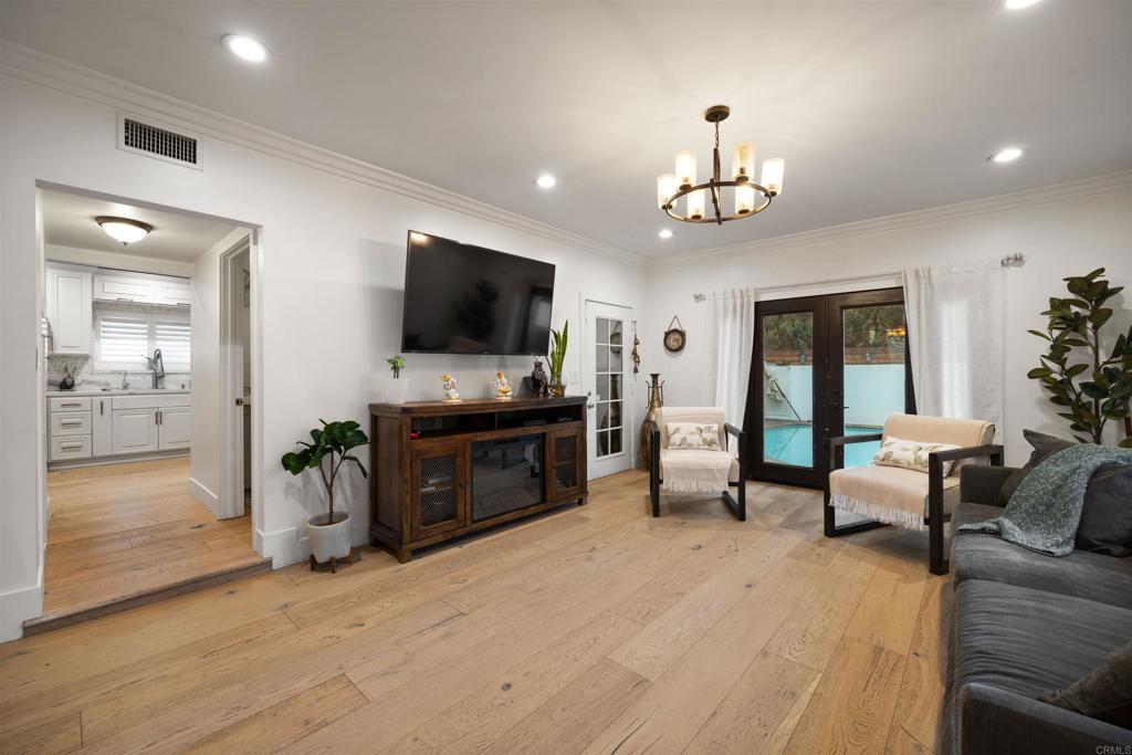 7965 4th Place Downey, CA 90241 - Photo 15 of 41 a living room with furniture and a flat screen tv