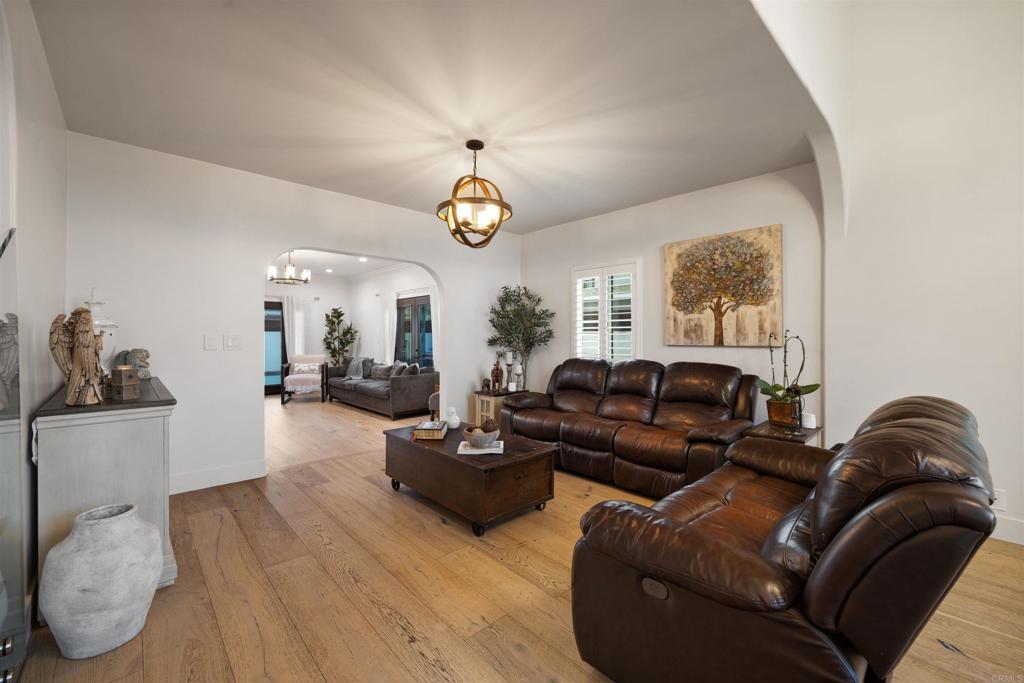 7965 4th Place Downey, CA 90241 - Photo 16 of 41 a living room with furniture chandelier and a window