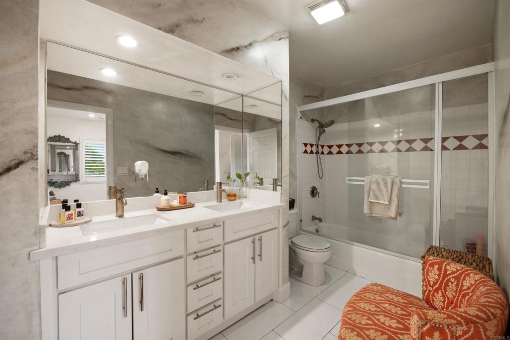 7965 4th Place Downey, CA 90241 - Photo 18 of 41 a spacious bathroom with a double vanity sink toilet mirror and shower