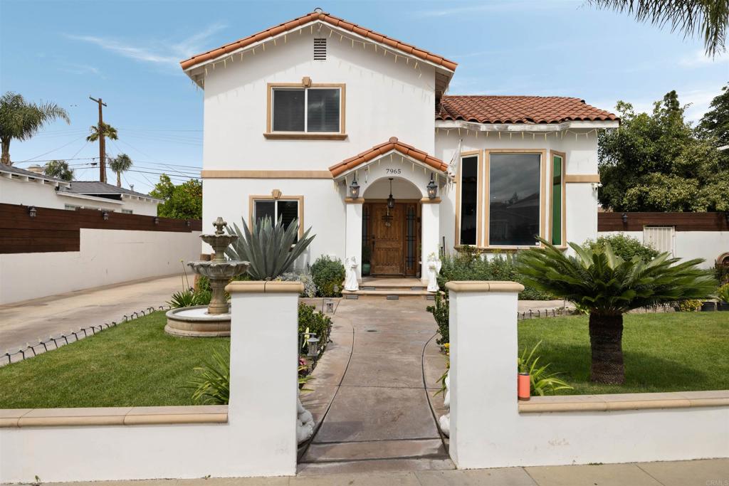 7965 4th Place Downey, CA 90241 - Photo 2 of 41 a front view of a house with a yard