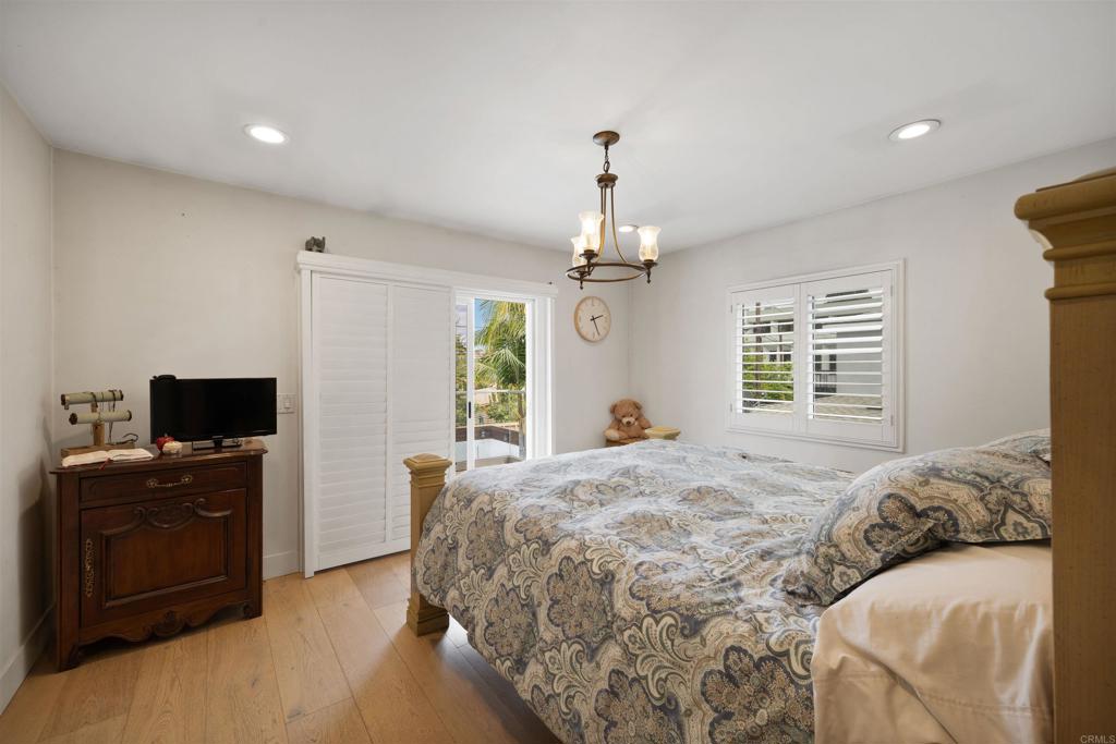 7965 4th Place Downey, CA 90241 - Photo 22 of 41 a bedroom with a bed and a flat screen tv