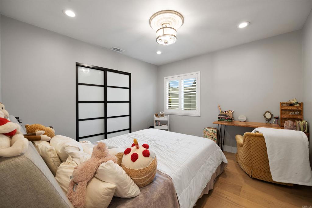 7965 4th Place Downey, CA 90241 - Photo 24 of 41 a bedroom with two beds and a window