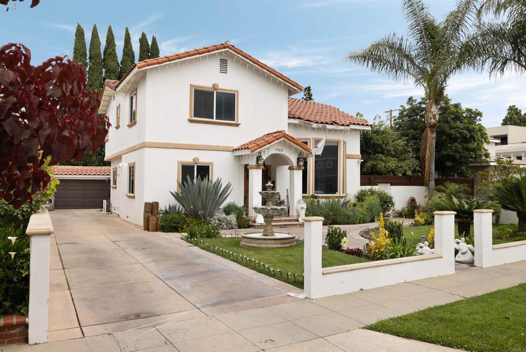 7965 4th Place Downey, CA 90241 - Photo 3 of 41 a front view of a house with a yard and potted plants