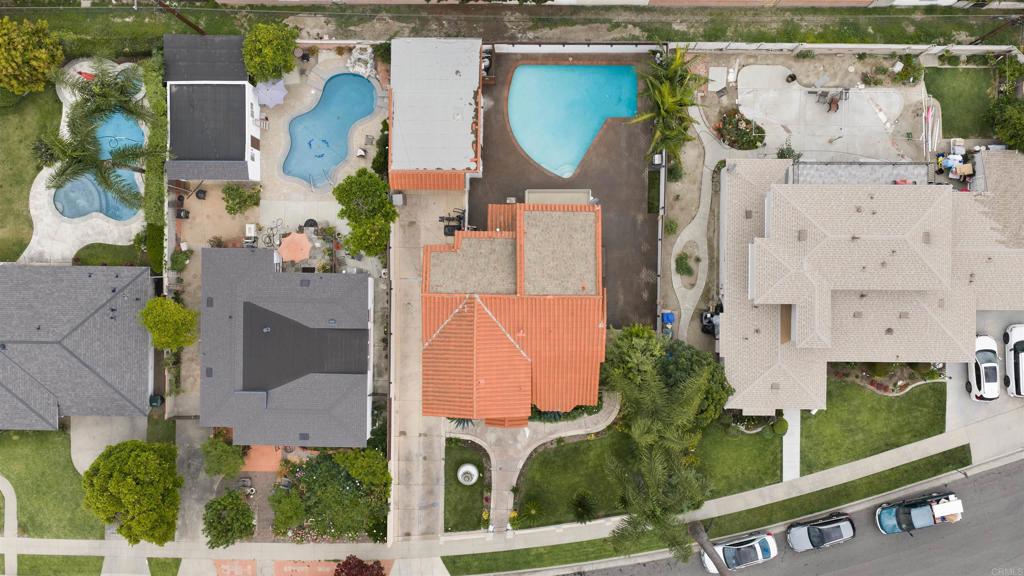 7965 4th Place Downey, CA 90241 - Photo 34 of 41 an aerial view of residential houses with outdoor space and parking