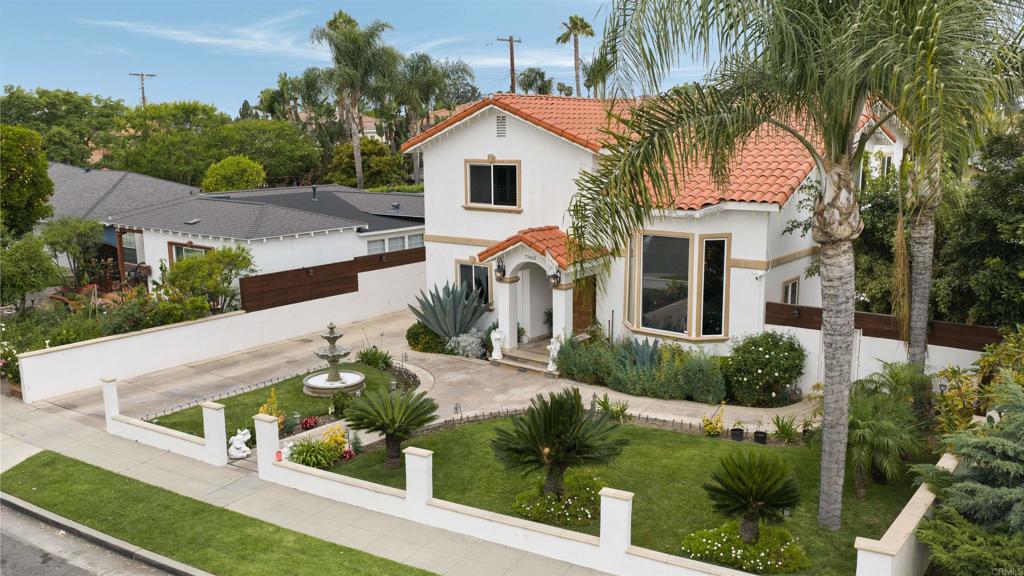 7965 4th Place Downey, CA 90241 - Photo 5 of 41 a front view of a house with garden