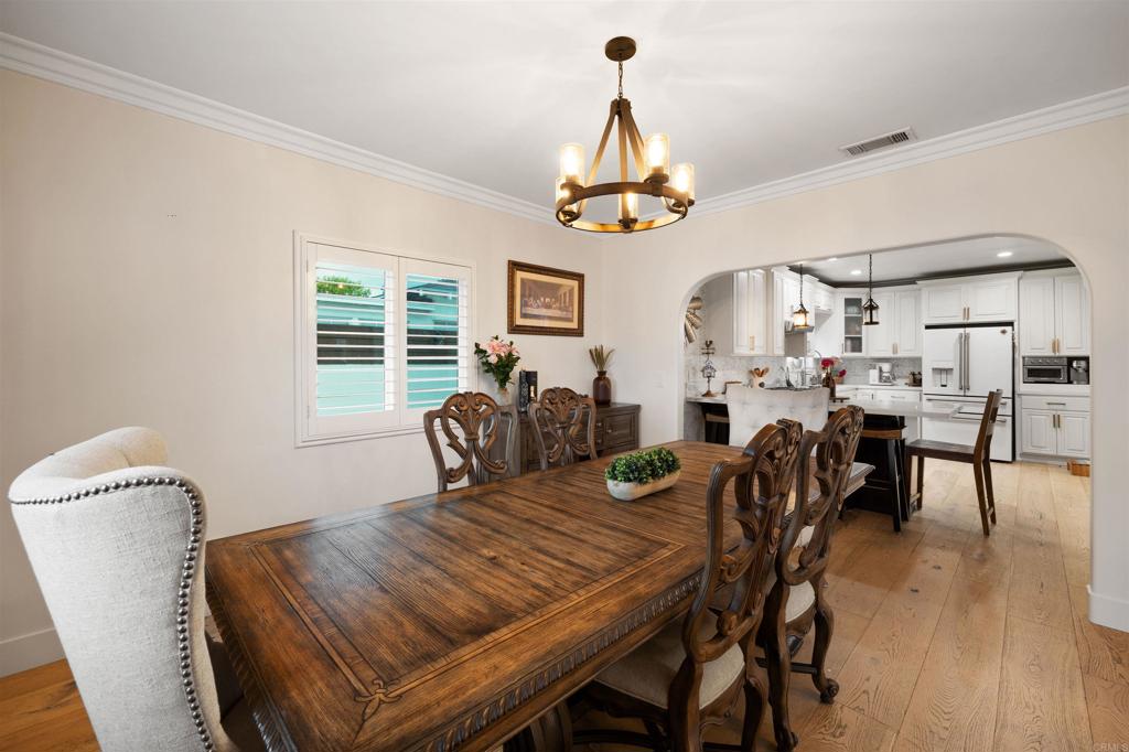 7965 4th Place Downey, CA 90241 - Photo 8 of 41 a view of a dining room with furniture window and wooden floor