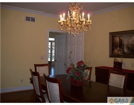 25 Harding Avenue Edison, NJ 08820 - Photo 22 of 24 a view of a dining room with furniture and chandelier