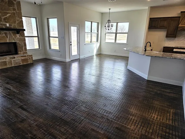 a view of a kitchen with furniture and floor to ceiling window