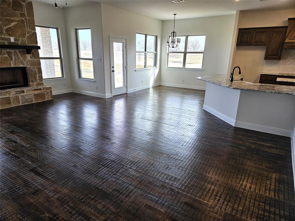 1453 Enloe Road Howe, TX 75459 - Photo 12 of 33 a view of a kitchen with furniture and floor to ceiling window