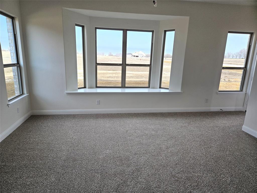 1453 Enloe Road Howe, TX 75459 - Photo 19 of 33 an empty room with a window