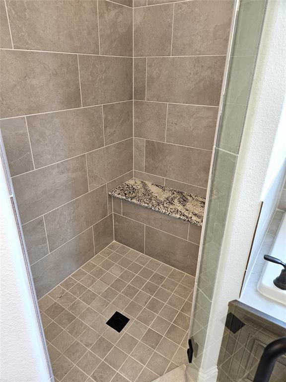 1453 Enloe Road Howe, TX 75459 - Photo 21 of 33 a bathroom with a sink and a shower