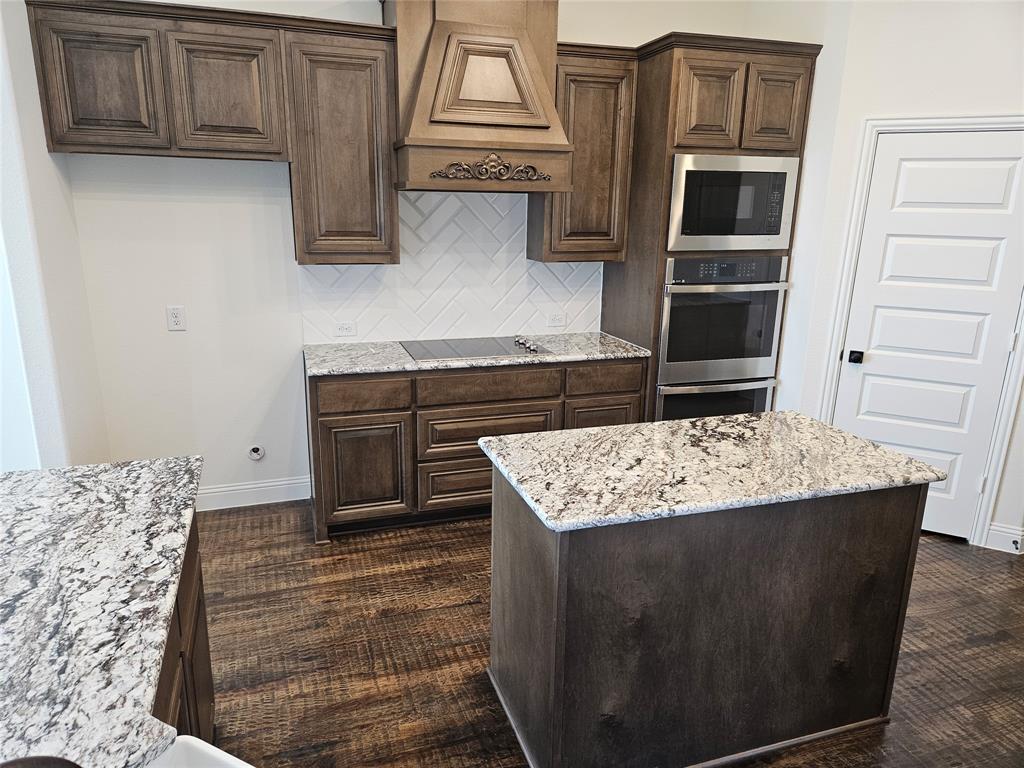 1453 Enloe Road Howe, TX 75459 - Photo 4 of 33 a kitchen with a stove and a refrigerator