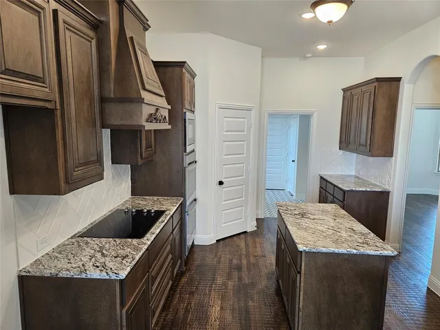 a kitchen that has a cabinets and a stove