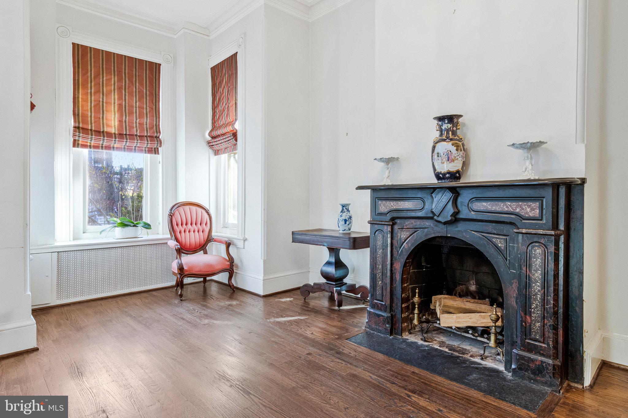 626 A Street Northeast Washington, DC 20002 - Photo 11 of 33 a living room with furniture and a fireplace