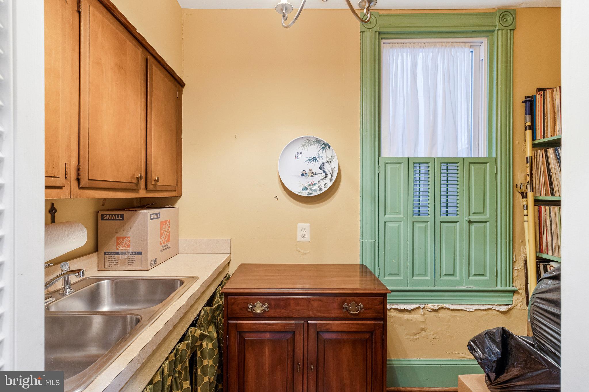 626 A Street Northeast Washington, DC 20002 - Photo 14 of 33 a kitchen with a sink cabinets and a large window