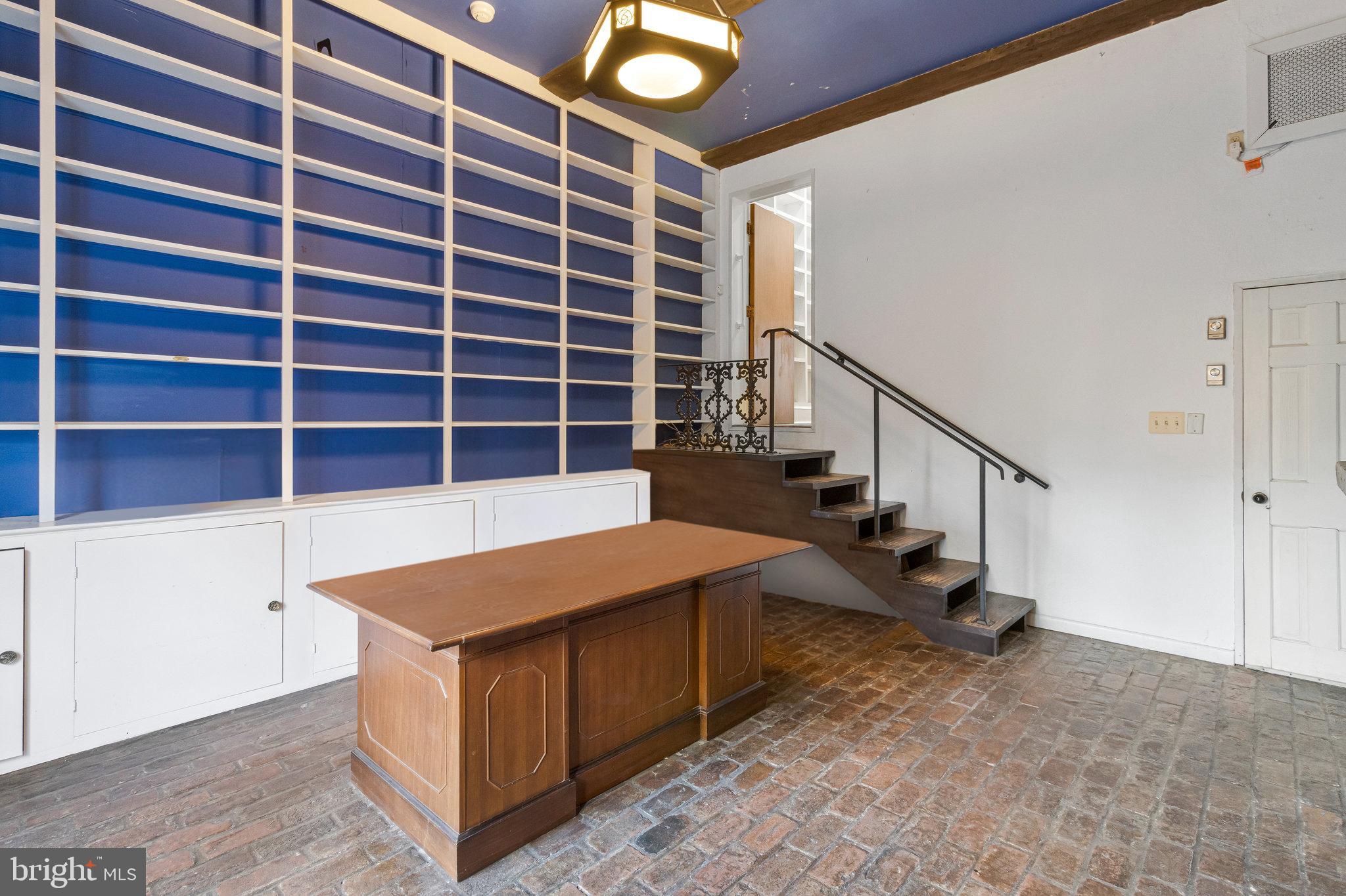 626 A Street Northeast Washington, DC 20002 - Photo 17 of 33 a view of kitchen and empty room with wooden floor and stairs