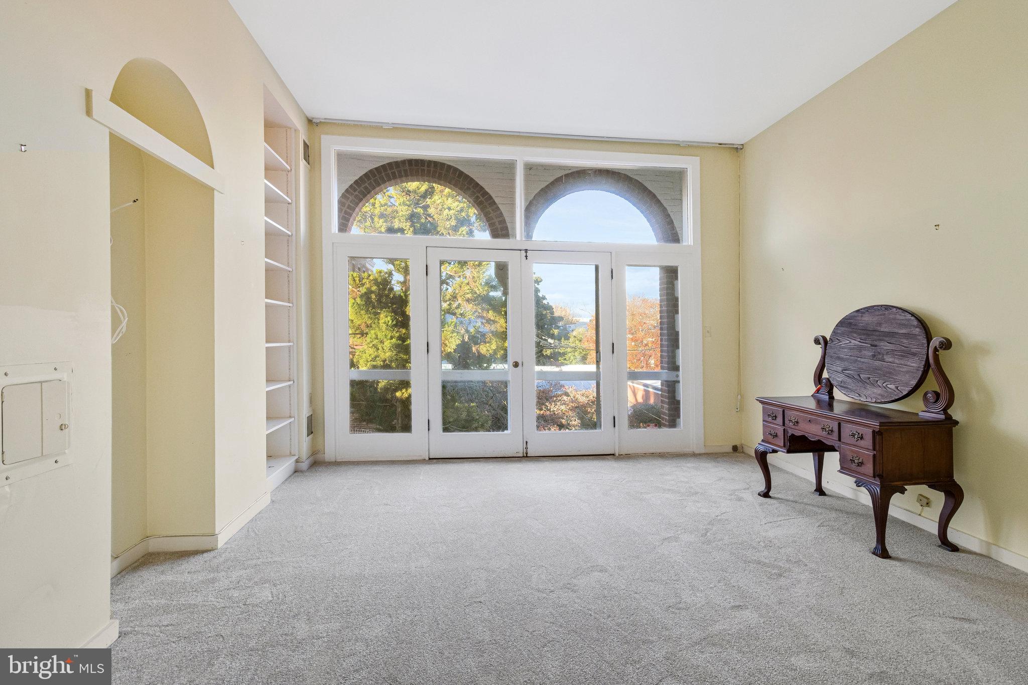 626 A Street Northeast Washington, DC 20002 - Photo 23 of 33 a living room with furniture and a large window