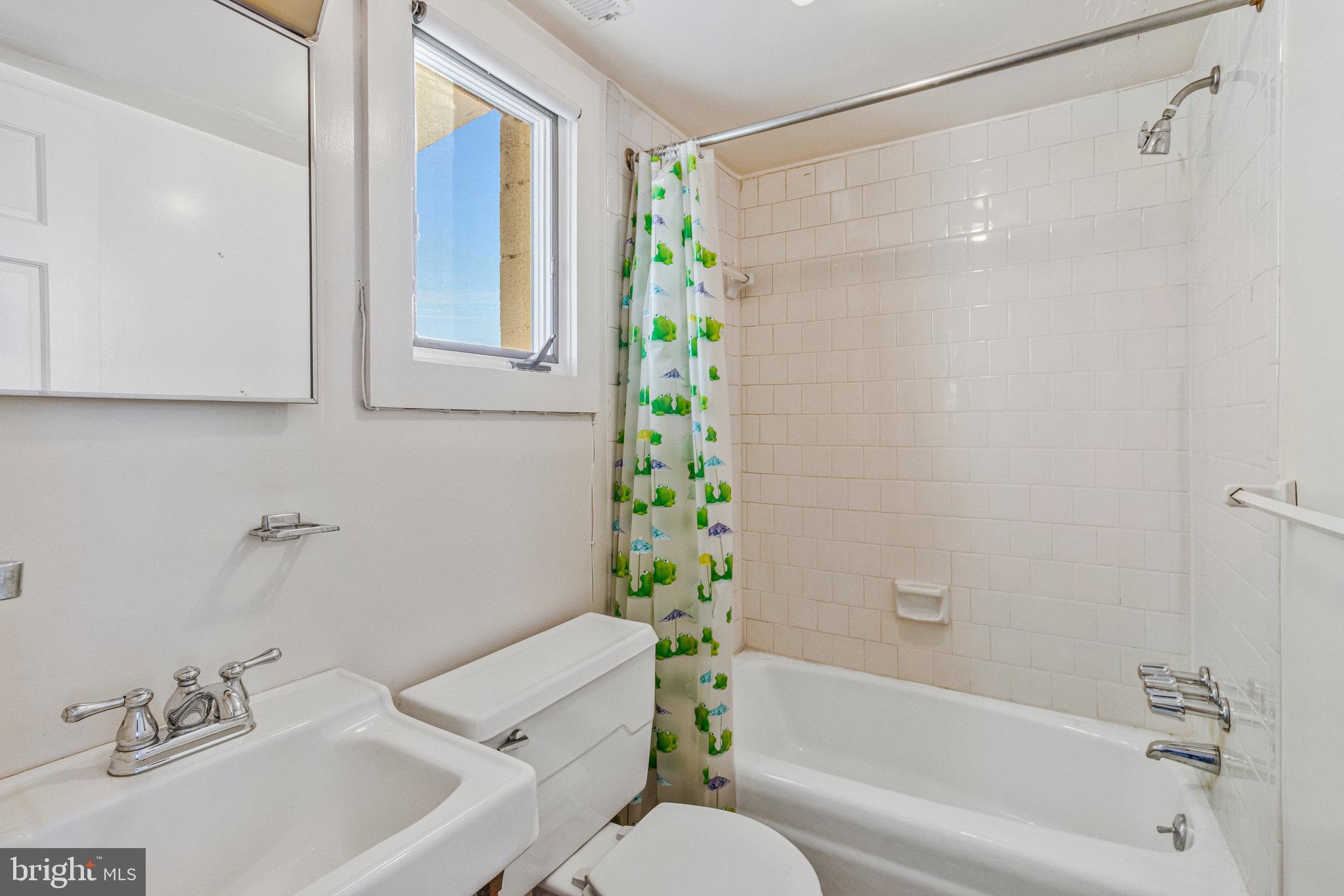 626 A Street Northeast Washington, DC 20002 - Photo 27 of 33 a bathroom with a sink and a bathtub with toilet