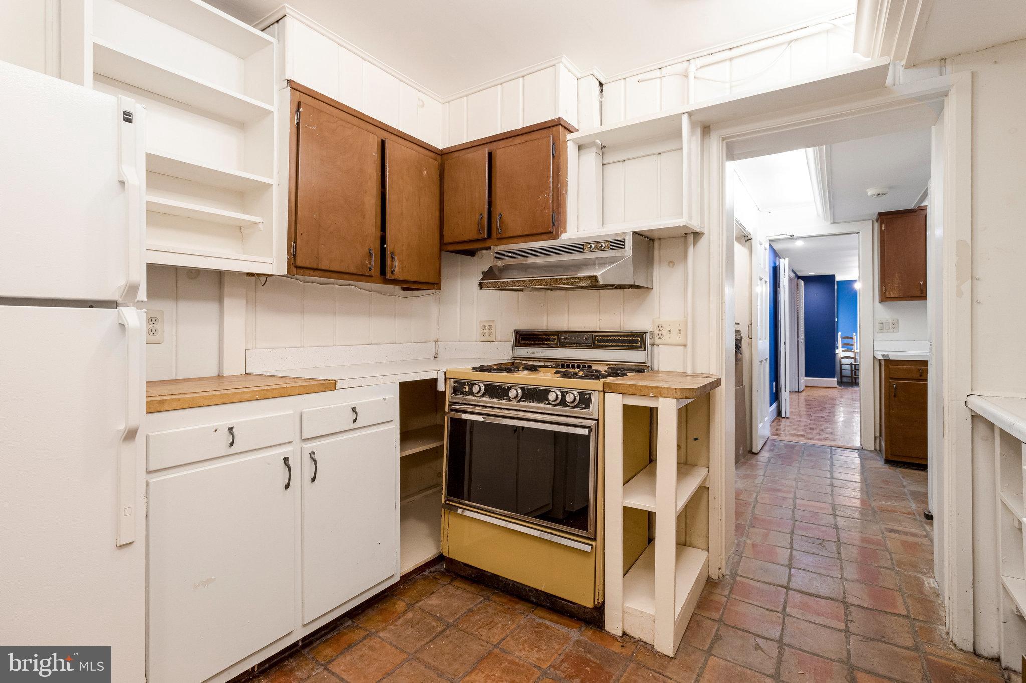 626 A Street Northeast Washington, DC 20002 - Photo 5 of 33 a kitchen with stainless steel appliances a stove a sink and a refrigerator