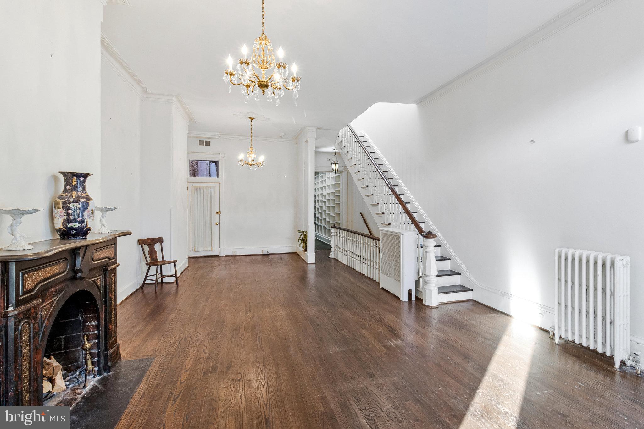 626 A Street Northeast Washington, DC 20002 - Photo 8 of 33 a view of a livingroom with wooden floor and a fireplace