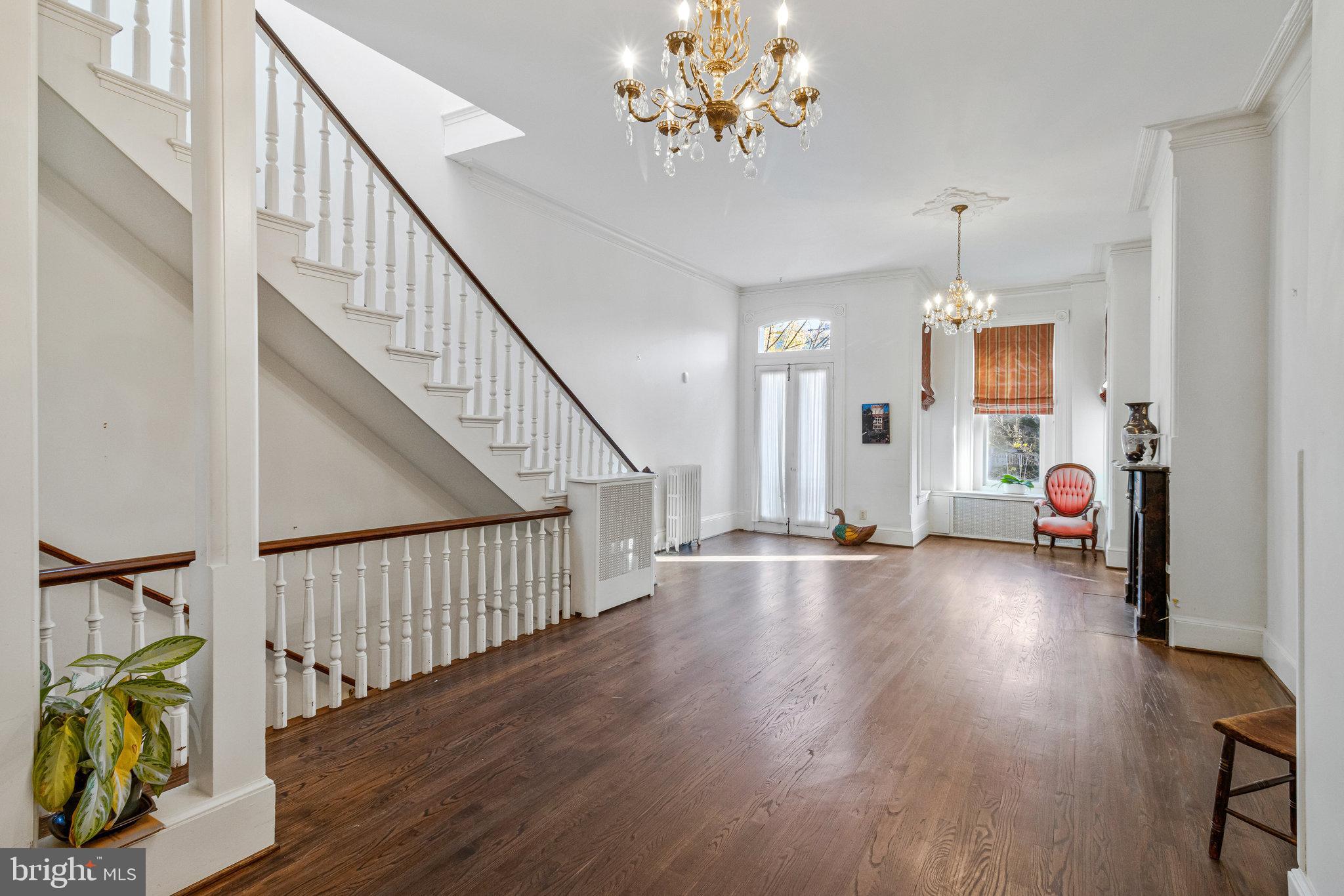626 A Street Northeast Washington, DC 20002 - Photo 10 of 33 a view of a hallway with wooden floor and staircase