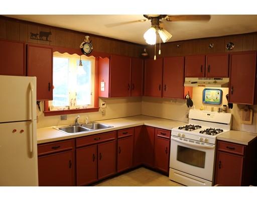 126 Arthur Street Springfield, MA 01104 - Photo 3 of 7 a kitchen with a sink appliances cabinets and a window