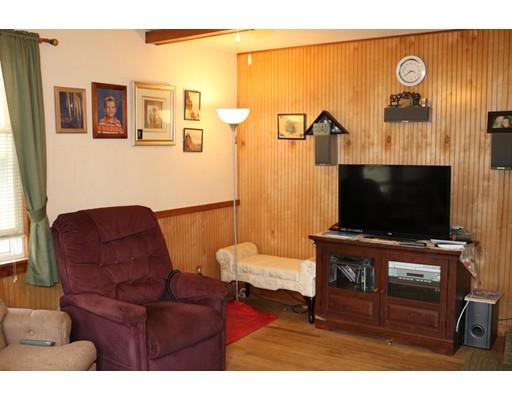 126 Arthur Street Springfield, MA 01104 - Photo 6 of 7 a living room with furniture and a flat screen tv