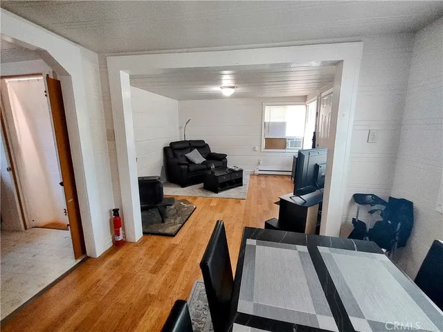 a room with a bed and windows