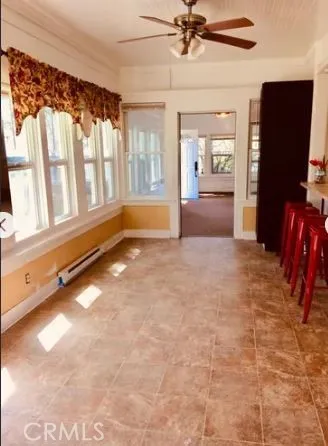 a view of kitchen with furniture and a refrigerator
