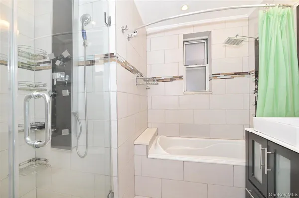 a bathroom with a bathtub and shower