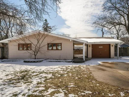 a view of a house with a snow in the yard