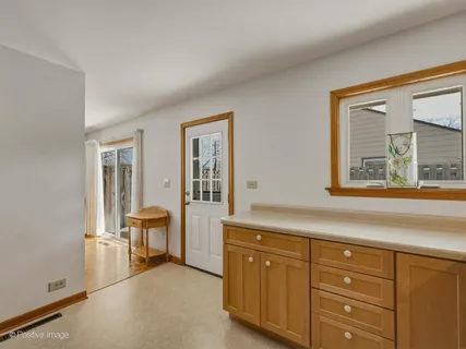 a spacious bathroom with double vanity sink a mirror and a shower