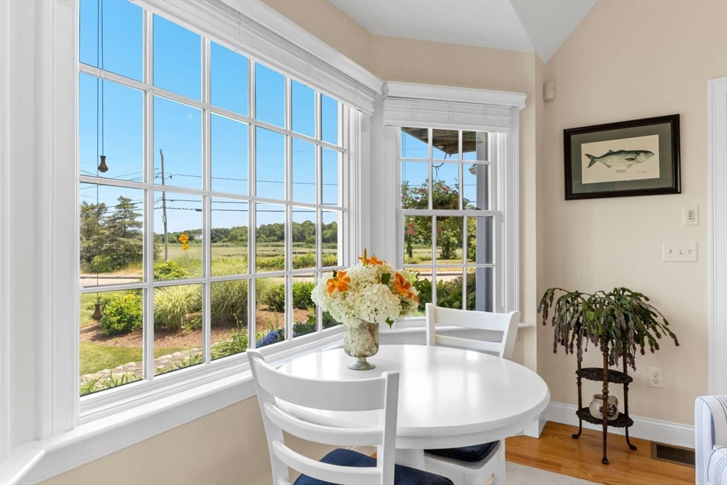 110 Commerce Road Barnstable, MA 02630 - Photo 12 of 41 a dining room with furniture window and wooden floor