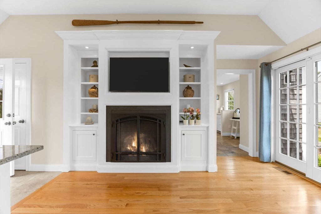 110 Commerce Road Barnstable, MA 02630 - Photo 14 of 41 a living room with a fireplace