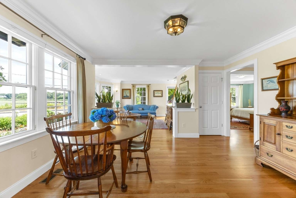 110 Commerce Road Barnstable, MA 02630 - Photo 20 of 41 a view of a dining room with furniture window and wooden floor