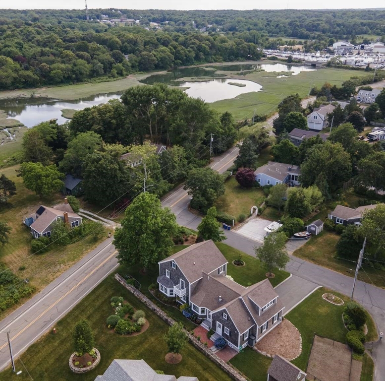 110 Commerce Road Barnstable, MA 02630 - Photo 2 of 41 an aerial view of a house with garden space and lake view