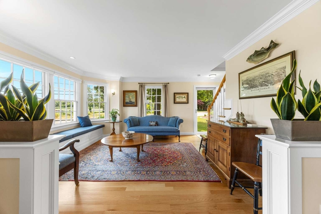 110 Commerce Road Barnstable, MA 02630 - Photo 23 of 41 a living room with furniture large window and wooden floor