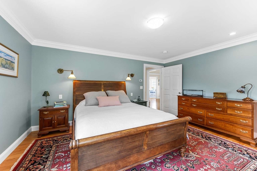 110 Commerce Road Barnstable, MA 02630 - Photo 28 of 41 a bedroom with a bed and a dresser
