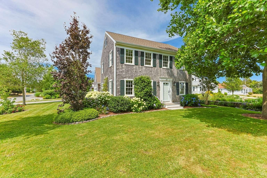 110 Commerce Road Barnstable, MA 02630 - Photo 3 of 41 a front view of house with yard and green space