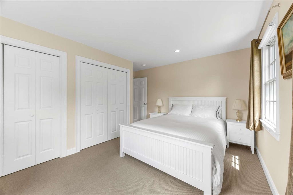 110 Commerce Road Barnstable, MA 02630 - Photo 36 of 41 a bedroom with a bed and a window
